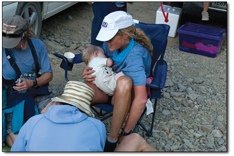 
  Racer Betsy Nye nurses her 1-year-old baby, Lizzy, at the Grouse Gulch aid station 42.1 miles into the course.
